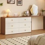 Modern White Wood Dresser with Drawers for Bedroom – Elegant Storage with Timeless Appeal Enhance your bedroom with the Modern White Wood Dresser with Drawers, a perfect blend of elegance, functionality, and modern design. This stylish dresser not only provides ample storage space but also adds a touch of sophistication to any bedroom décor. Moreover, its clean white finish and sturdy wooden structure make it a long-lasting and visually appealing furniture piece. Contemporary and Versatile Design Featuring a minimalist modern look, this dresser fits effortlessly into a variety of bedroom styles—from Scandinavian to classic contemporary. Additionally, its smooth white surface and refined edges create a calm and inviting atmosphere. Therefore, it’s ideal for both master bedrooms and guest rooms seeking a neat, elegant aesthetic. Durable Wooden Construction Built from high-quality wood, this dresser ensures strength and stability for years of reliable use. Furthermore, its smooth drawer slides and robust frame guarantee durability and everyday functionality. As a result, the Modern White Wood Dresser delivers both beauty and performance. Spacious Storage for Everyday Essentials The dresser comes with multiple wide drawers, providing ample space for organizing clothing, accessories, and personal items. In addition, the drawers glide smoothly, allowing effortless access to stored items. Consequently, it helps you maintain a clean and organized bedroom while keeping everything within reach. Features of the Modern White Wood Dresser with Drawers High-Quality Wooden Build: Ensures long-lasting durability and stability. Elegant White Finish: Adds a modern, refreshing look to any bedroom. Spacious Drawers: Perfect for storing clothes, linens, and accessories. Smooth-Glide Drawer System: Allows easy and quiet opening and closing. Flat Top Surface: Ideal for displaying décor, lamps, or mirrors. Versatile Design: Complements modern, classic, and minimalist interiors. Perfect for Bedroom Organization and Style Because of its balanced mix of beauty and practicality, this white wood dresser enhances your bedroom’s functionality while maintaining a sleek look. Moreover, it serves as both a storage solution and a stylish focal point in your room. Therefore, it’s perfect for anyone looking to upgrade their bedroom furniture with elegance and purpose. Easy to Maintain and Long-Lasting In addition to its stylish appeal, this dresser is easy to clean and maintain. Simply wipe the surface with a soft cloth to keep it looking new. Furthermore, its durable finish resists scratches and stains, ensuring that it stays beautiful for years. Consequently, it’s a reliable investment for long-term bedroom organization. A Blend of Beauty, Function, and Durability Ultimately, the Modern White Wood Dresser with Drawers for Bedroom is designed to meet all your storage and style needs. Its contemporary design, ample storage capacity, and strong craftsmanship make it a standout piece for any home. Upgrade your bedroom today with this elegant dresser—where modern design meets timeless functionality.