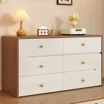 Modern White Wood Dresser with Drawers for Bedroom – Elegant Storage with Timeless Appeal Enhance your bedroom with the Modern White Wood Dresser with Drawers, a perfect blend of elegance, functionality, and modern design. This stylish dresser not only provides ample storage space but also adds a touch of sophistication to any bedroom décor. Moreover, its clean white finish and sturdy wooden structure make it a long-lasting and visually appealing furniture piece. Contemporary and Versatile Design Featuring a minimalist modern look, this dresser fits effortlessly into a variety of bedroom styles—from Scandinavian to classic contemporary. Additionally, its smooth white surface and refined edges create a calm and inviting atmosphere. Therefore, it’s ideal for both master bedrooms and guest rooms seeking a neat, elegant aesthetic. Durable Wooden Construction Built from high-quality wood, this dresser ensures strength and stability for years of reliable use. Furthermore, its smooth drawer slides and robust frame guarantee durability and everyday functionality. As a result, the Modern White Wood Dresser delivers both beauty and performance. Spacious Storage for Everyday Essentials The dresser comes with multiple wide drawers, providing ample space for organizing clothing, accessories, and personal items. In addition, the drawers glide smoothly, allowing effortless access to stored items. Consequently, it helps you maintain a clean and organized bedroom while keeping everything within reach. Features of the Modern White Wood Dresser with Drawers High-Quality Wooden Build: Ensures long-lasting durability and stability. Elegant White Finish: Adds a modern, refreshing look to any bedroom. Spacious Drawers: Perfect for storing clothes, linens, and accessories. Smooth-Glide Drawer System: Allows easy and quiet opening and closing. Flat Top Surface: Ideal for displaying décor, lamps, or mirrors. Versatile Design: Complements modern, classic, and minimalist interiors. Perfect for Bedroom Organization and Style Because of its balanced mix of beauty and practicality, this white wood dresser enhances your bedroom’s functionality while maintaining a sleek look. Moreover, it serves as both a storage solution and a stylish focal point in your room. Therefore, it’s perfect for anyone looking to upgrade their bedroom furniture with elegance and purpose. Easy to Maintain and Long-Lasting In addition to its stylish appeal, this dresser is easy to clean and maintain. Simply wipe the surface with a soft cloth to keep it looking new. Furthermore, its durable finish resists scratches and stains, ensuring that it stays beautiful for years. Consequently, it’s a reliable investment for long-term bedroom organization. A Blend of Beauty, Function, and Durability Ultimately, the Modern White Wood Dresser with Drawers for Bedroom is designed to meet all your storage and style needs. Its contemporary design, ample storage capacity, and strong craftsmanship make it a standout piece for any home. Upgrade your bedroom today with this elegant dresser—where modern design meets timeless functionality.