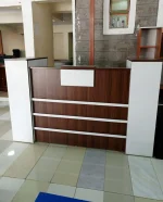 reception desk, reception counter, front desk, lobby reception desk, office reception desk, modern reception desk, contemporary reception desk, minimalist reception desk, luxury reception desk, executive reception desk, wooden reception desk, solid wood reception desk, engineered wood reception desk, MDF reception desk, laminate reception desk, veneer reception desk, glass reception desk, metal reception desk, steel frame reception desk, marble top reception desk, high gloss reception desk, matte finish reception desk, curved reception desk, straight reception desk, L shaped reception desk, U shaped reception desk, corner reception desk, modular reception desk, custom reception desk, bespoke reception desk, compact reception desk, small reception desk, large reception desk, wide reception desk, narrow reception desk, tall reception desk, low height reception desk, reception desk with storage, reception desk with drawers, reception desk with cabinets, reception desk with shelves, reception desk with lockable drawer, reception desk with filing cabinet, reception desk with keyboard tray, reception desk with cable management, reception desk with wire management, reception desk with grommet holes, reception desk with power outlets, reception desk with USB ports, reception desk with LED lighting, reception desk with backlit panel, reception desk with logo panel, reception desk; Reception desk in Nairobi, Reception desk in Westlands, Reception desk in Kilimani, Reception desk in Karen, Reception desk in Lavington, Reception desk in Runda, Reception desk in Kileleshwa, Reception desk in Eastleigh, Reception desk in Embakasi, Reception desk in South B, Reception desk in South C, Reception desk in Kasarani, Reception desk in Roysambu, Reception desk in Zimmerman, Reception desk in Ruaka, Reception desk in Thome, Reception desk in Pangani, Reception desk in Ngara, Reception desk in Parklands, Reception desk in Donholm, Reception desk in Umoja, Reception desk in Kayole, Reception desk in Buruburu, Reception desk in Pipeline, Reception desk in Githurai, Reception desk in Kariobangi, Reception desk in Dandora, Reception desk in Industrial Area Nairobi, Reception desk in Upper Hill, Reception desk in Nairobi CBD, Reception desk in Mombasa, Reception desk in Nyali, Reception desk in Bamburi, Reception desk in Likoni, Reception desk in Changamwe, Reception desk in Kisumu, Reception desk in Milimani Kisumu, Reception desk in Migosi, Reception desk in Nakuru, Reception desk in Lanet, Reception desk in Naka, Reception desk in Eldoret, Reception desk in Langas, Reception desk in Pioneer Eldoret, Reception desk in Thika, Reception desk in Ruiru, Reception desk in Juja, Reception desk in Kiambu, Reception desk in Limuru, Reception desk in Rongai, Reception